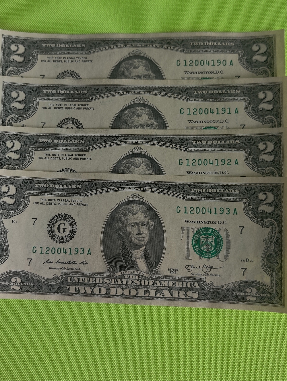 Four US $2 Bills - Green and Gray